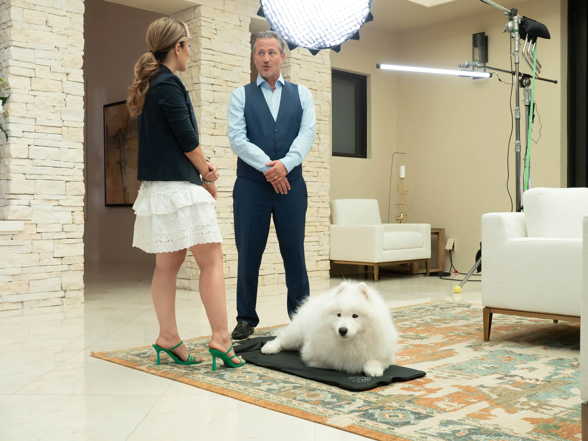 A guest and a host on set between takes