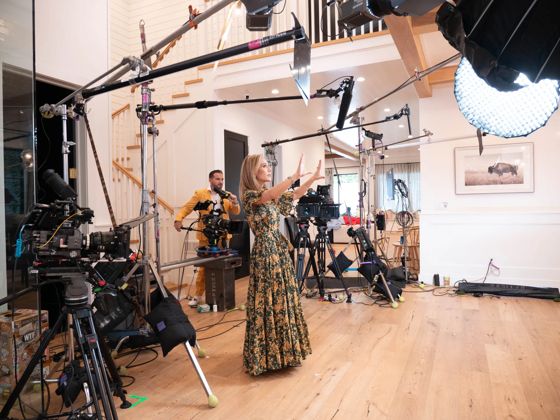A host rehearsing on a set with a jib and several cameras