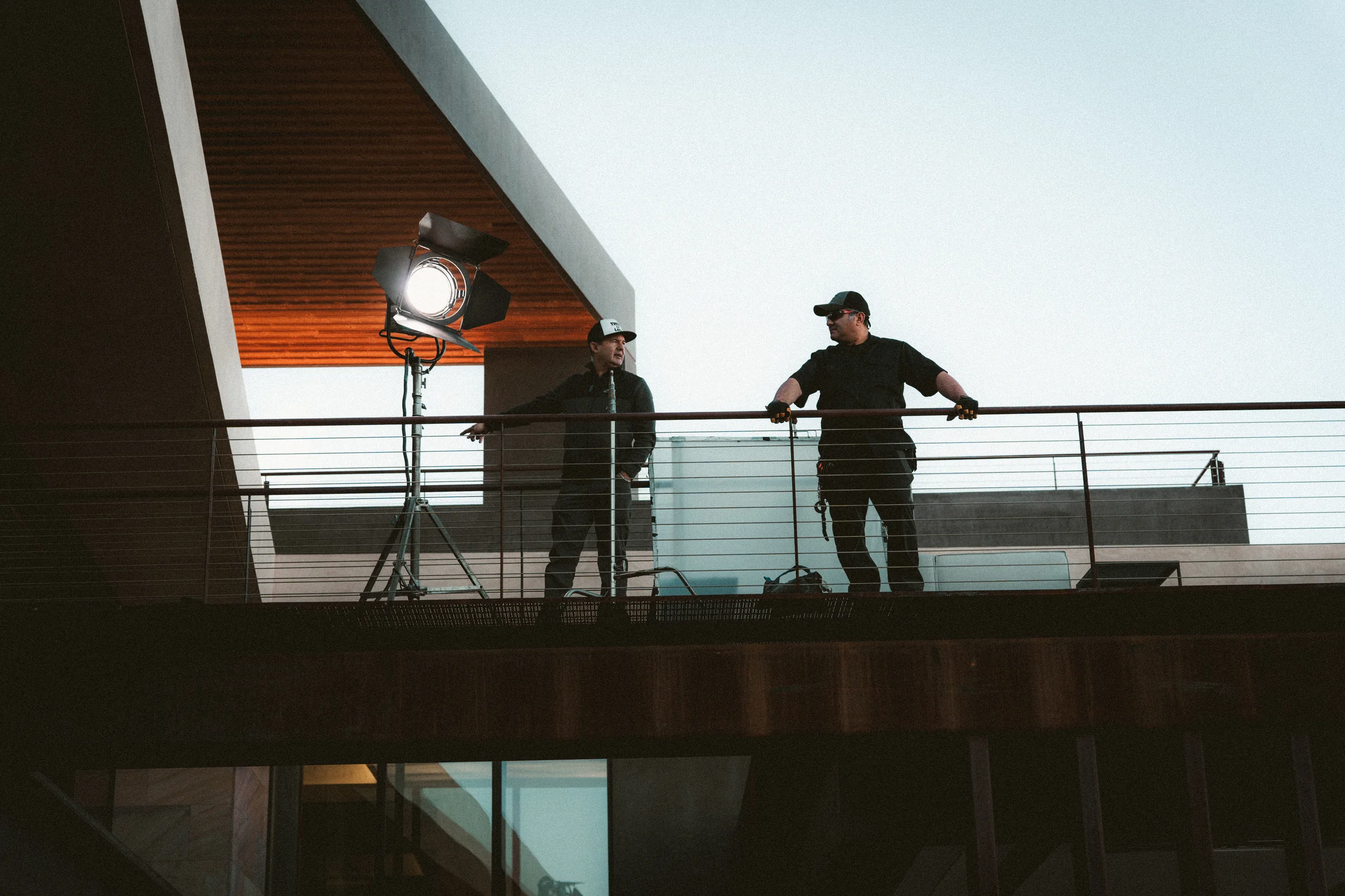 On the balcony. Grip and electric at last light, on the sHEALed set