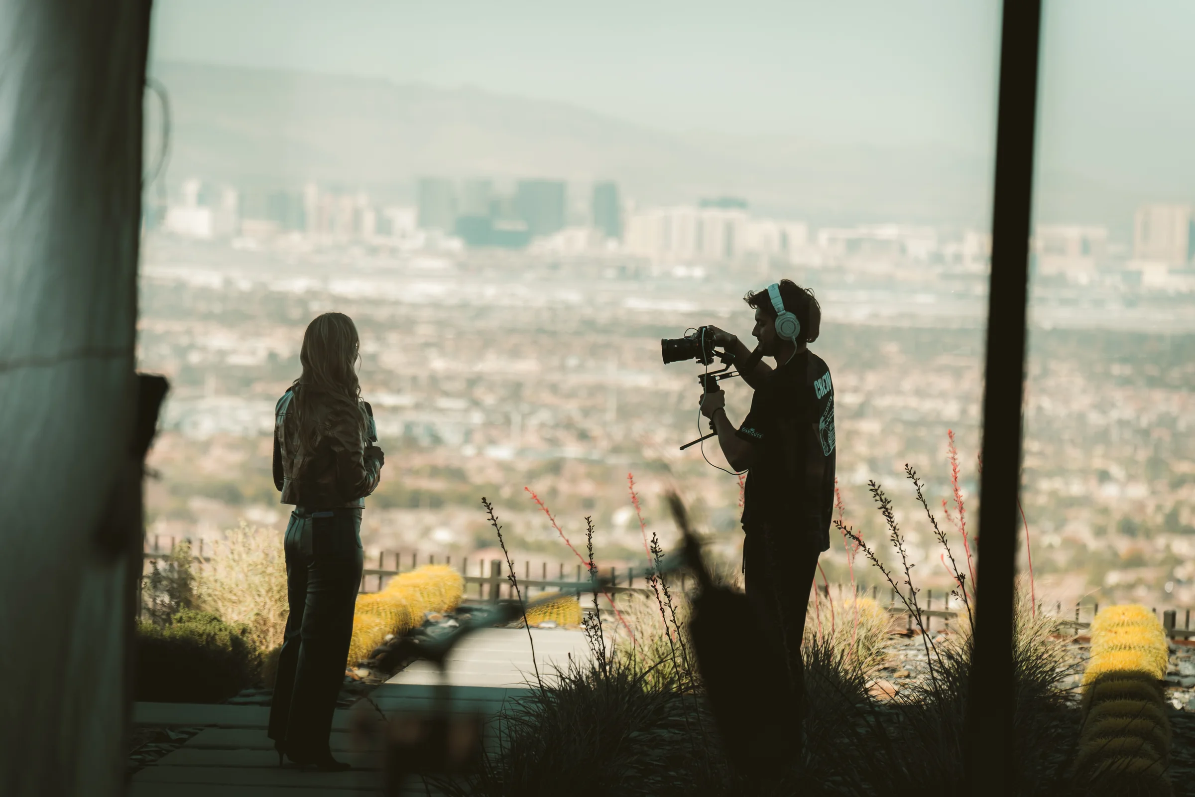 An interview in silhouette on the sHEALed set, the city behind