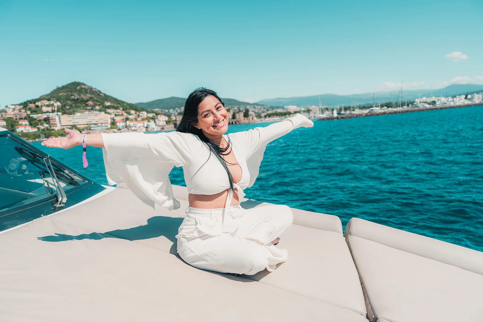 A guest dancing on deck at sea during premiere week in Cannes