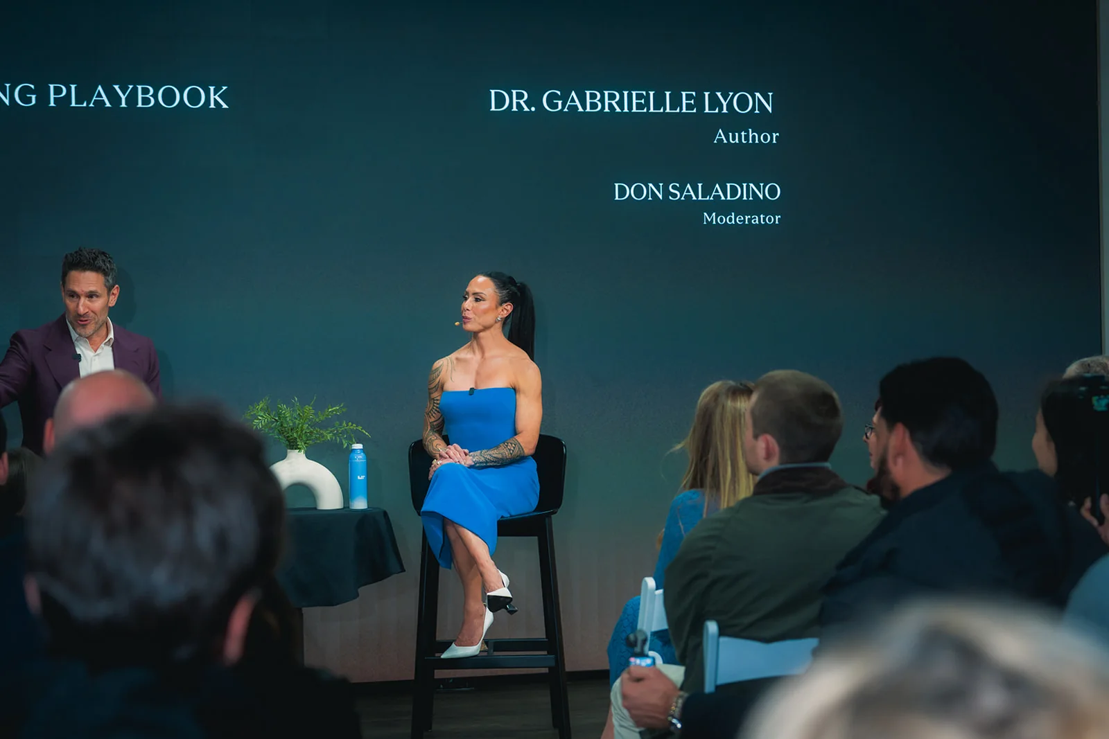 Dr. Gabrielle Lyon and the moderator, Don Saladino, on stage