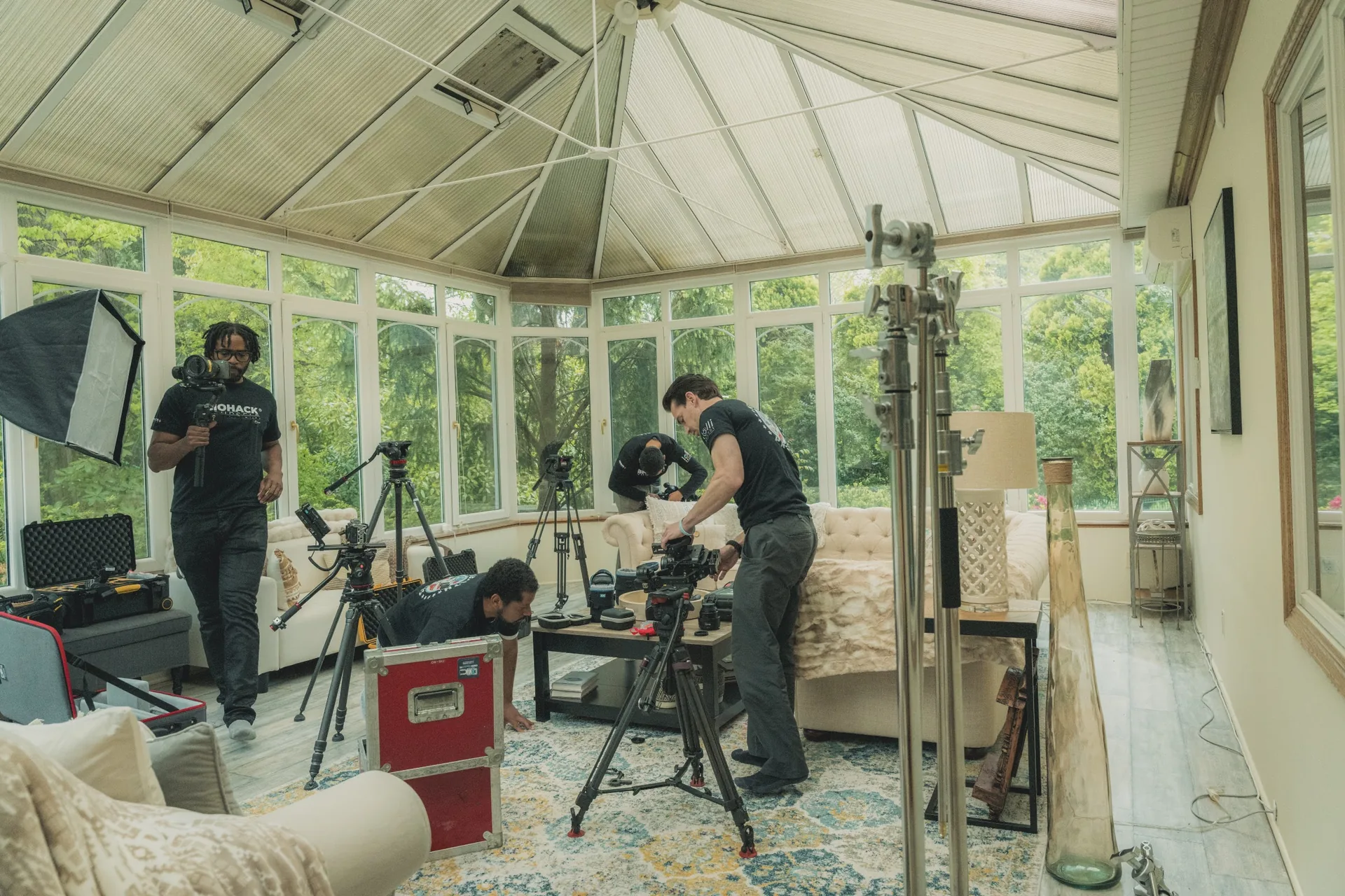 Crew building a set inside a conservatory